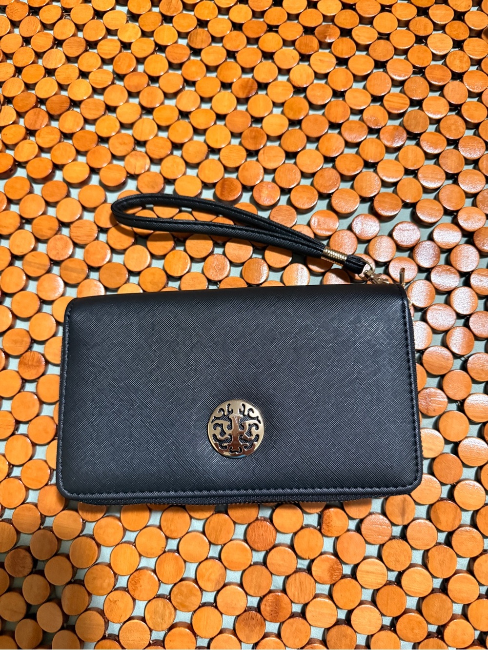Classic Black Wristlet Clutch with Decorative Gold Emblem